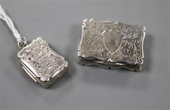 A Victorian silver shaped rectangular vinaigrette, Hilliard & Thomason, Birmingham, 1884 and one other.